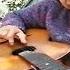 Babushka Plays Guitar Blues With An Electric Bulb