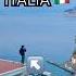 Crazy Person Standing On Italian Roof Overlooking The City At Sunset