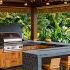 Island Inspired Tropical Outdoor Kitchens In Modern Single Story Homes With Garden Appeal