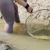 Using The Pump To Suck Water Out Of The Deep Puddle The Girl Caught A Lot Of Big Fish