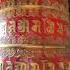 Spinning The Prayer Wheel At The Boudha Stupa In Kathmandu Nepal