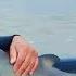 Man Rescues Baby Dolphin Then A Woman Yells And Points Behind Him