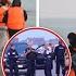 Moment Migrants Pack Into Dinghies For UK As French Authorities Look On