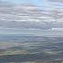 Под крылом самолёта о чём то поёт зелёное море тайги
