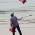 Balloon Appears To Follow Man Cleaning Beach
