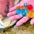 Remove The Oversized Yellow Beads From The Pearl Clam